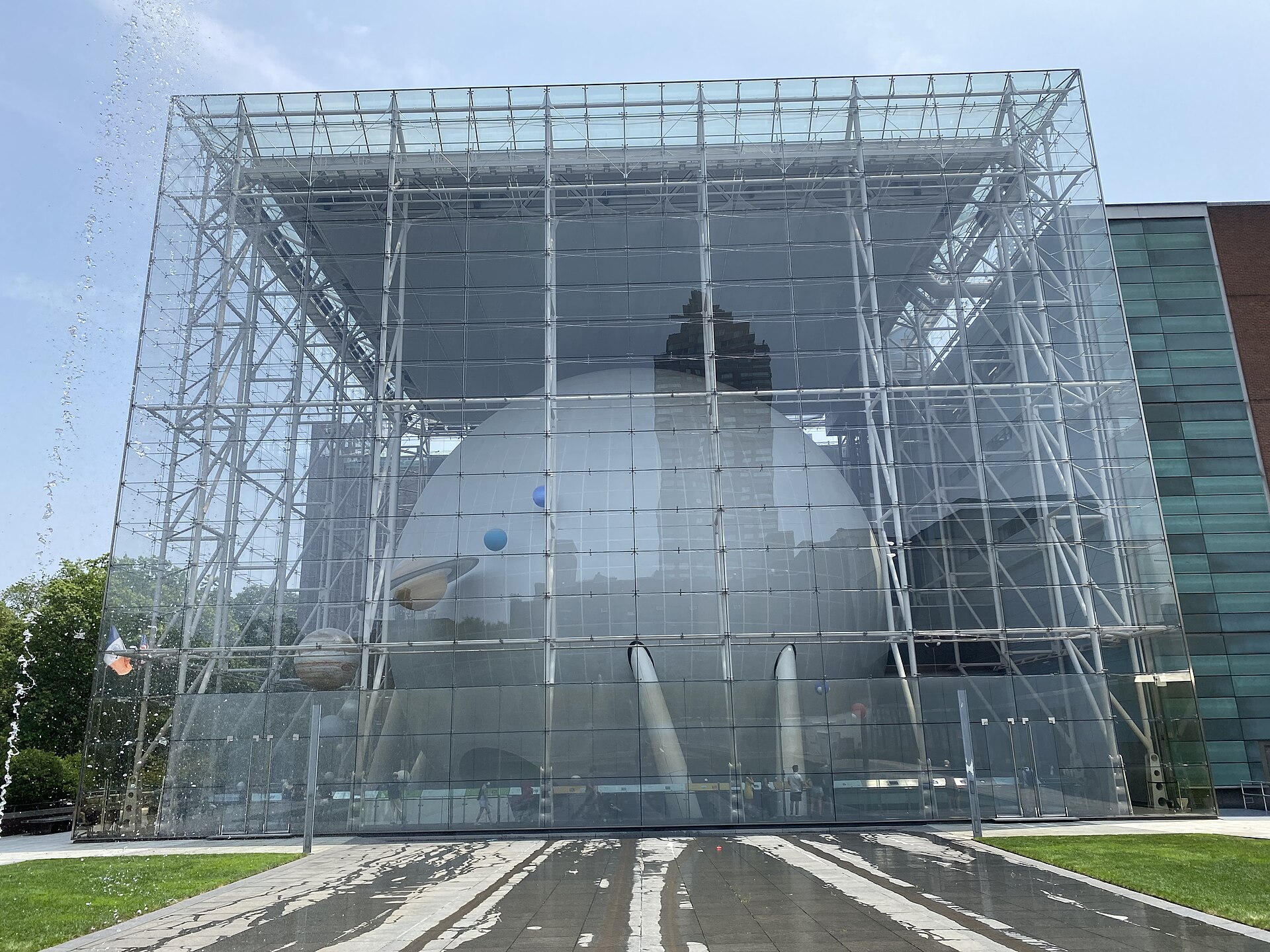 The Rose Center glass facade and Hayden Sphere in daylight