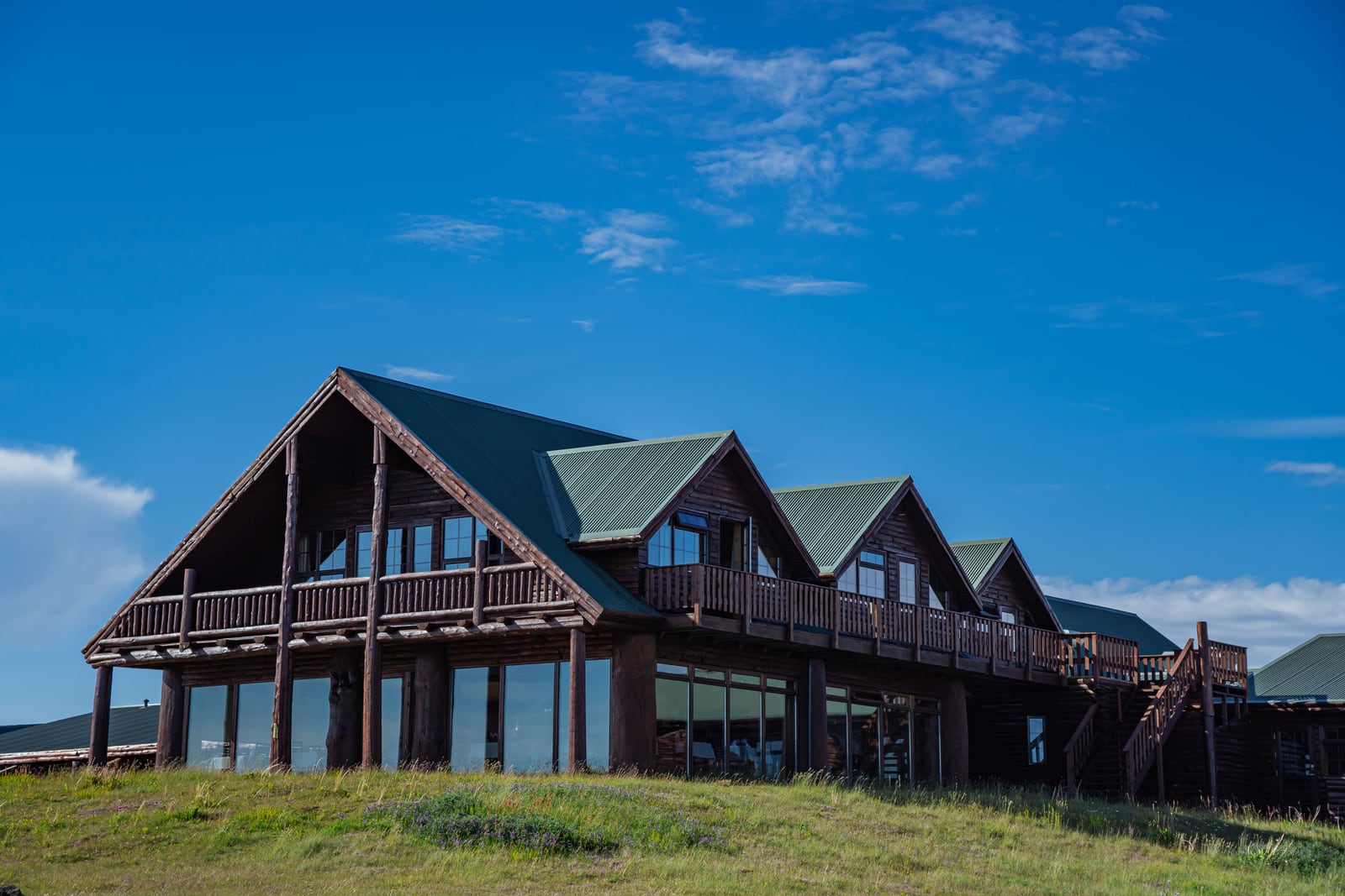 The timber exterior and balconies of Hotel Rangá in summer
